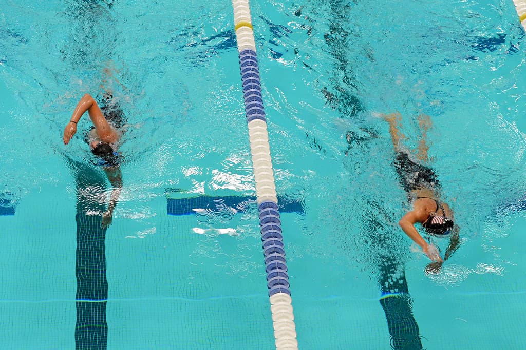 Swimming athletes in action